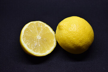 Close up of lemon slice on black background