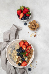 Bowl of fresh homemade oatmeal porridge with  berries. Healthy food for Breakfast.