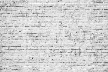 Fototapety  Texture of a brick wall with cracks and scratches which can be used as a background