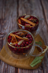 berry juice with orange slices in a glass cup