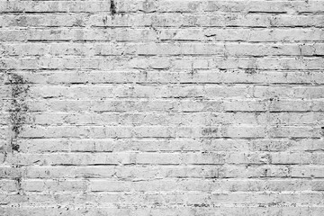 Texture of a brick wall with cracks and scratches which can be used as a background