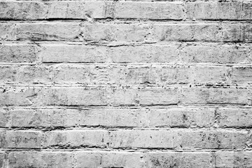 Texture of a brick wall with cracks and scratches which can be used as a background