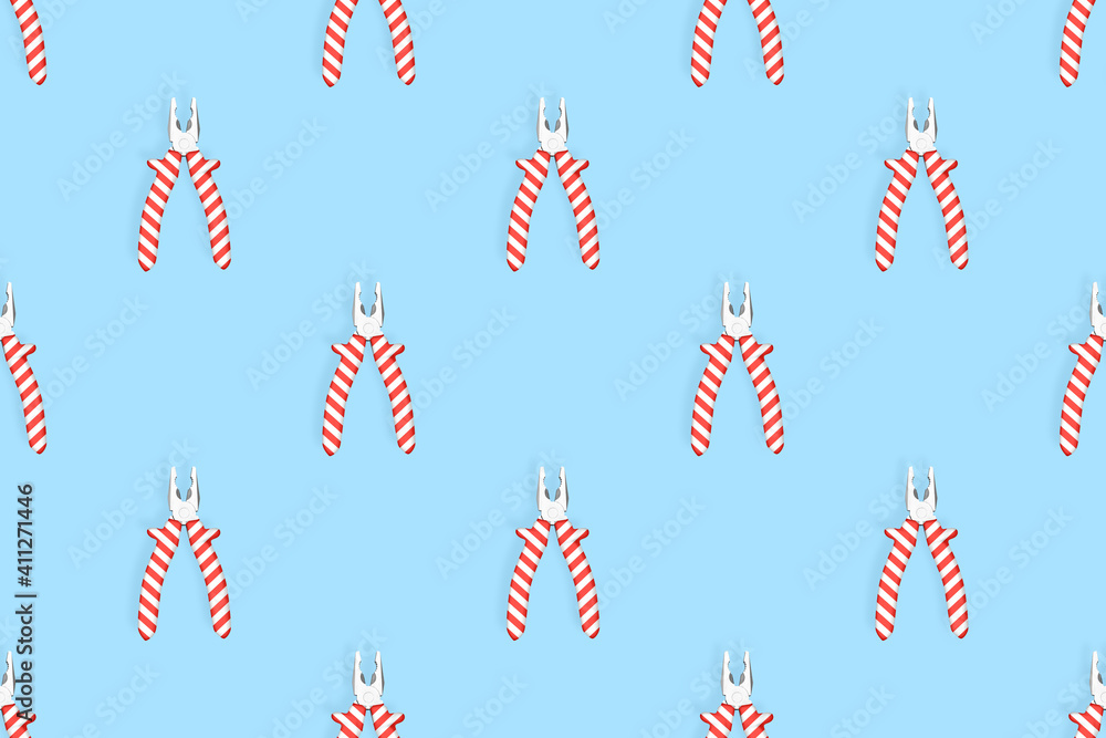 Wall mural Pliers seamless pattern. Metal pliers with rubber striped grips. Background made of tools. 