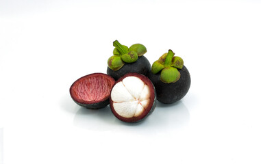 group organic mangosteen fruit violet and green color. cut half peel sweet dessert in summer season thailand. multi vitamin juicy freshness vegetarian. Isolated on white background