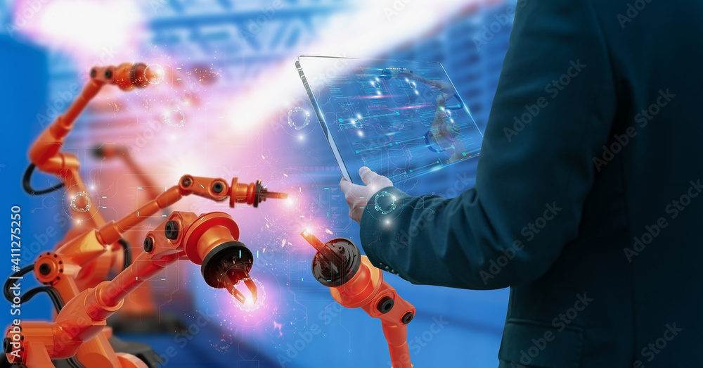 Wall mural industry engineer in factory,using smart tablet glass device,control automation robot arm machine in