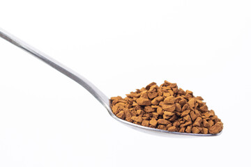 Small spoon with green tea with a slide on a white background. Selective focus. Healthy food concept.