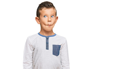 Adorable caucasian kid wearing casual clothes making fish face with lips, crazy and comical gesture. funny expression.