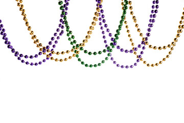 Three colour Merdi gras beads isolated on white background © vetre