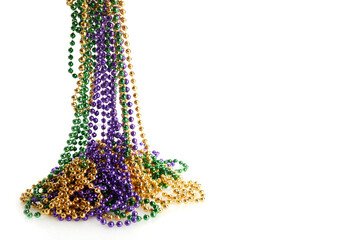 Three colour Merdi gras beads isolated on white background © vetre