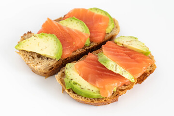 Homemade Toast sandwich with Salmon, Avocado on on a slice of grain bread. healthy food