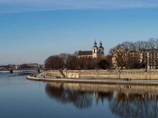 Obraz premium Poland, Cracow - view over Vistula Riverbanks and St. Michael the Archangel and St. Stanisław Church. Winter time.