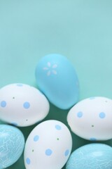 Easter holiday.Easter blue and white  eggs set on light blue background.Spring festive easter background in pastel colors