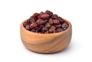 Raisins in wooden bowl isolated on white background. Clipping path.