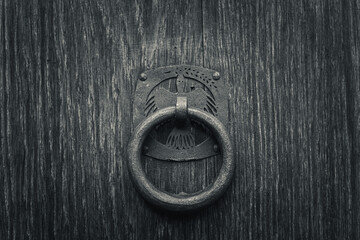 ancient door knob on old wood door
