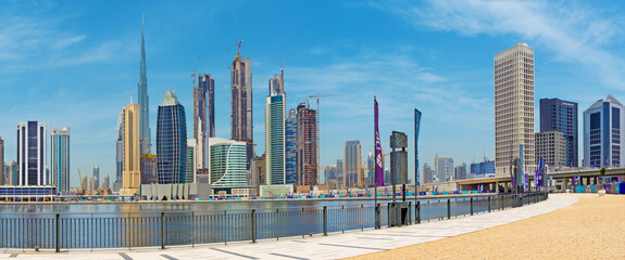 DUBAI, UAE - MARCH 29, 2017: The skyline over the new Canal and Downtown and  the promenade.