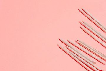 Set of cosmetic tools for manicure and pedicure on a orange background. Manicure sticks top view.