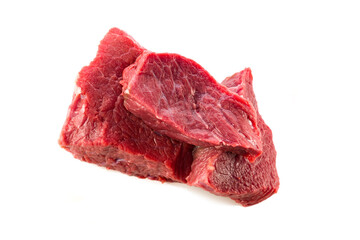 Raw beef, sliced pieces for cooking, isolated on a white background, close-up