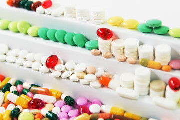 Many various medical pills in rows