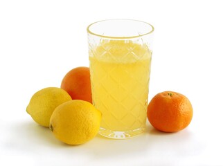 lemons and mandarines and glass of sweet juice