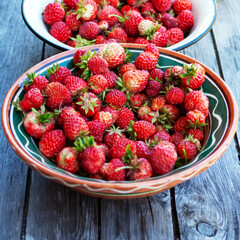 strawberries on a plate lie on the board