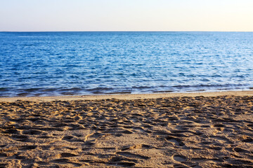footprints in the sand by the sea