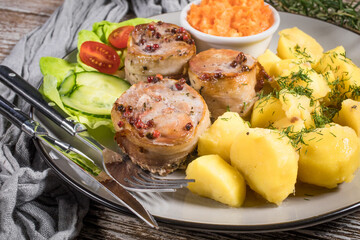 Pork tenderloin wrapped in bacon.