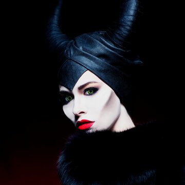 beautiful girl with horns on black background