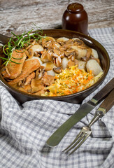 Stewed pork chop in a bright mushroom sauce.