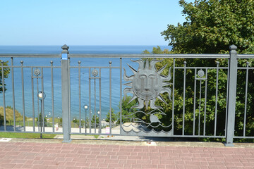 Decorative metal fence on the background of the Baltic Sea. Svetlogorsk, Kaliningrad region