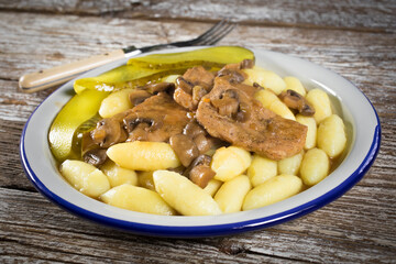 Braised pork loin with mushrooms.