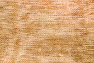 bag fabric texture closeup, orange background.