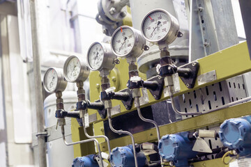 pressure gauges stand in a row