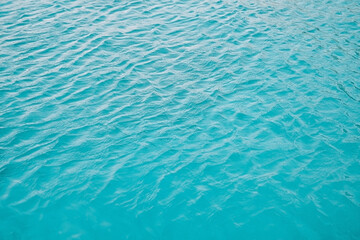Fototapeta na wymiar beautiful bright blue water, texture of the water surface of blue color.
