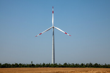 wind turbines on cloudy blue sky background