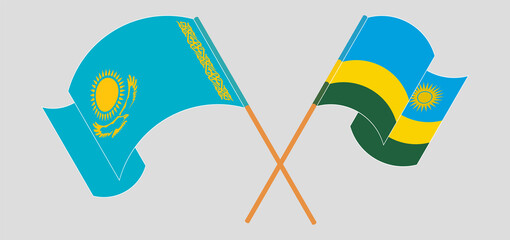 Crossed and waving flags of Kazakhstan and Rwanda