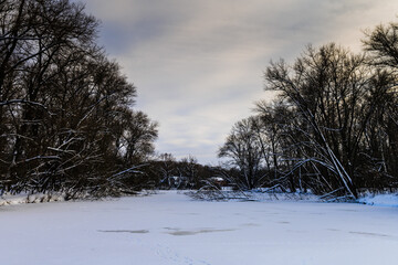 Landscape on a frozen river in a winter evening2