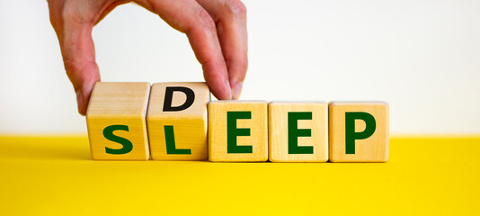 Sleep deep symbol. Doctor turns wooden cubes with words sleep deep. Beautiful yellow table, white background, copy space. Healthy lifestyle, medical and sleep deep concept.