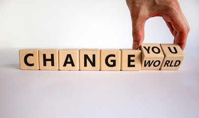 Change world or you symbol. Businessman turns wooden cubes and changes words 'change world' to 'change you'. Beautiful white background, copy space. Business and change yourself concept.