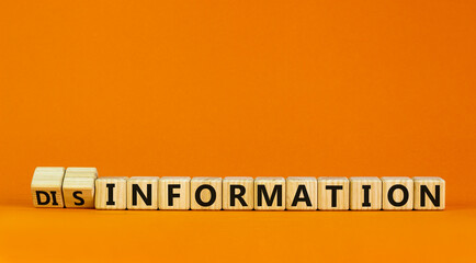 Information or disinformation symbol. Turned cubes and changed words disinformation to information....