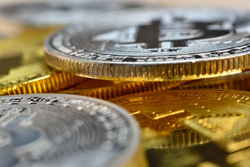 Silver and golden cryptocurrency bitcoin coins.