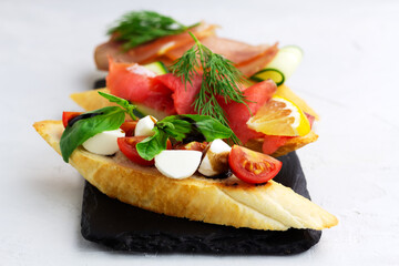 Diffrent types of bruschetta on toasted bread. Italian cuisine