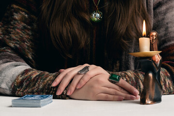 Fortune teller is reading the future with tarot cards close up.