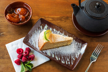 A slice of tender cheesecake with lemon