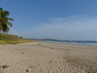 Tropical beach, with the sea at one side and the jungle at the other. Pacific Coast of Costa Rica