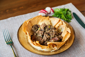 Appetizing meat in baked lavash according