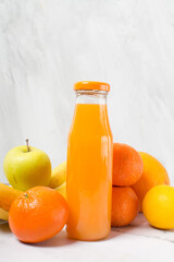 fresh citrus fruit juice in glass bottle, tangerine juice