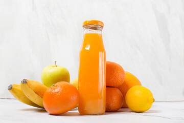 fresh citrus fruit juice in glass bottle, tangerine juice