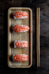 maki on gray plate and wooden table