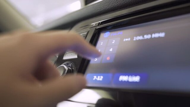 Hand adjust the car's radio button, LCD display, 4K, Soft focus