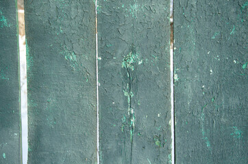 dark old fence boards with cracked paint